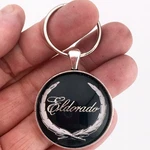 Vintage Cadillac Eldorado Wreath Crest Chrome Badge Emblem 1.2" Dia. Keychain. Fixed Price $12.95.