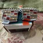 1980'S Cadillac Trunk Key Hole Cover Slider Oem Ornament Emblem 20260724 2017027. Fixed Price $100.00.