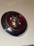 Vintaage Mercury Chrome / Red Trunk Lock Cover. Fixed Price $44.99.